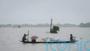 Floods and landslides triggered by heavy rains in India kill at least 16 people