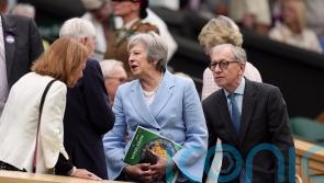 Theresa May and Romeo Beckham among spectators on drizzly day three of Wimbledon
