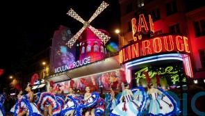 Moulin Rouge restores windmills after collapse