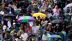 Heavy downpours suspend play on outdoor courts at Wimbledon