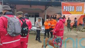 Search intensifies for dozens buried in Indonesia landslide that killed 23