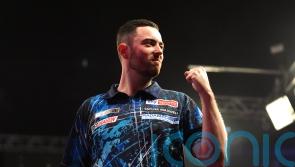 Luke Humphries battles past Dimitri Van den Bergh to reach Blackpool semis
