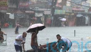 Taiwan prepares for strong typhoon as monsoon rains kill 13 in the Philippines