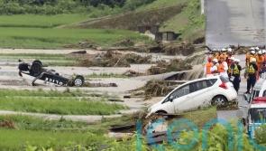 Hundreds flee as heavy rain in northern Japan triggers floods and landslides