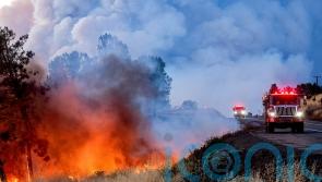 Man arrested over California fire sparked by burning car pushed into gully