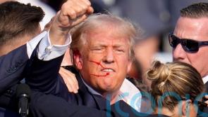 Trump struck by bullet during assassination attempt, FBI says