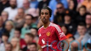 Manchester United defender Leny Yoro seen on crutches with left foot injury