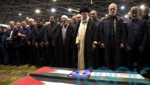 Iran’s supreme leader prays over coffin of Hamas leader