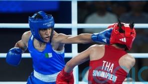 Algerian fans celebrate as Imane Khelif books place in women’s 66kg final