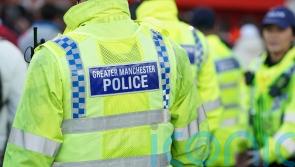 Two people arrested on suspicion of murder after man falls from Salford balcony