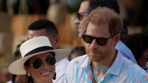 Meghan wears &lsquo;big smile&rsquo; during visit to Colombian music school with Harry