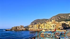 One dead and six missing after boat carrying UK tourists sinks off Sicily