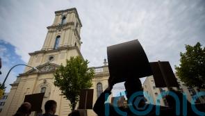 Protests as German president inaugurates rebuilt tower of church with Nazi links