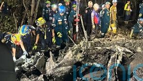 Searchers dig in muddy swamp where tourist plane crashed near Bangkok