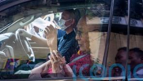 Dalai Lama returns to Indian headquarters after knee replacement surgery in US