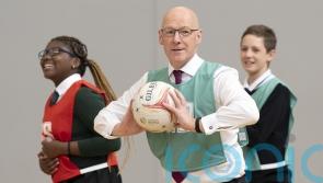 Swinney joins netball match to mark two decades of Active Schools programme