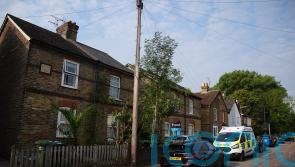 Three children and man found dead in Surrey house