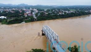 Bridge collapses as more rain falls in Vietnam, raising storm death toll to 21