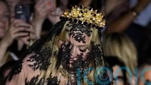 Madonna makes veiled entrance to Dolce & Gabbana for show marking 1990s heyday
