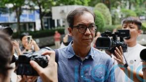 Hong Kong court sentences former editor to 21 months in jail