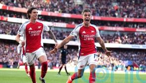 Arsenal strike twice in stoppage time to see off stubborn Leicester