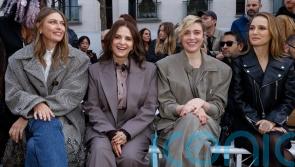 Natalie Portman, Greta Gerwig, Maria Sharapova and more sit in the rain to support Stella McCartney at Paris Fashion Week