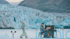 British singer performs duet amid Arctic icebergs in call for climate protection