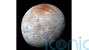 Nasa detects traces of carbon dioxide on surface of Pluto’s largest moon