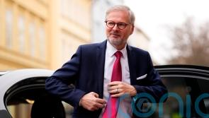 Czech government reshuffled after party leaves but parliament majority retained