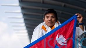 Record-setting teenage climber returns to hero’s welcome in Nepal