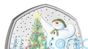 Gold Snowman coin hidden in advent calendar for someone to find on Christmas Eve