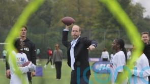William shows off &lsquo;unbelievable arm&rsquo; playing American football with youngsters