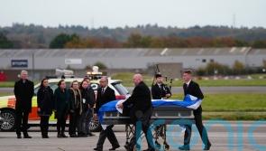 Alex Salmond’s body met by family and piper as plane lands in Aberdeen