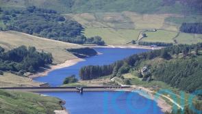Divers search overnight for man who went into reservoir