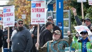 Boeing reports &pound;4.6bn quarterly loss ahead of vote by union members