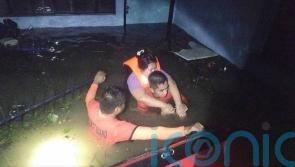 Widespread floods, people trapped on roofs as tropical storm nears Philippines