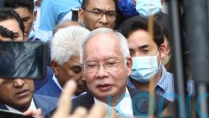 Former Malaysian PM apologises for embezzlement scandal and reiterates innocence