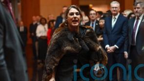 Woman charged with assaulting Australian senator who shouted at the King