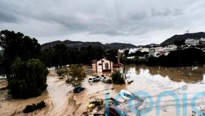 Floods in Spain sweep away cars, disrupt trains and leave several people missing