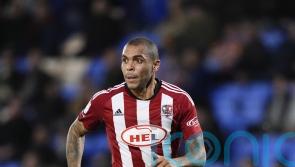 Josh Magennis scores hat-trick as Exeter edge past Barnet in FA Cup thriller