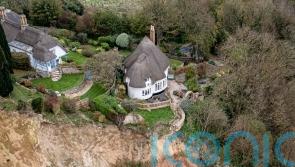 Cottage left teetering on cliff edge following massive landslip