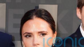 Victoria Beckham given a women of the year prize by daughter Harper