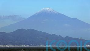 Mount Fuji gets its trademark snowcap after the longest delay in 130 years