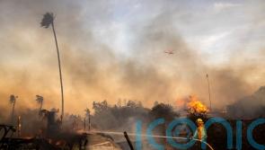 Firefighters gain ground on Calfornia wildfire as weather conditions improve