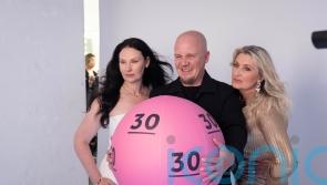 Lottery winners snapped by celebrity photographer for 30th anniversary