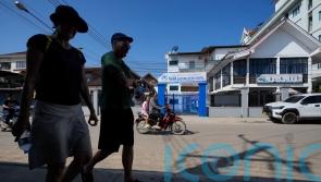 Laos government ‘saddened’ by suspected poisoning deaths and is investigating