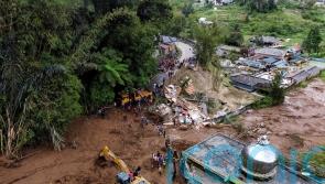 Rescuers recover 20 bodies from flash floods and landslides on Sumatra