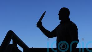 Fact check: Video of man in balaclava holding knives was filmed in the US