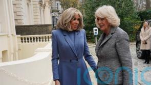 Recovering Queen embraces France’s first lady at literary award ceremony