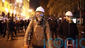 Opposition leader arrested during police raid on offices amid unrest in Georgia